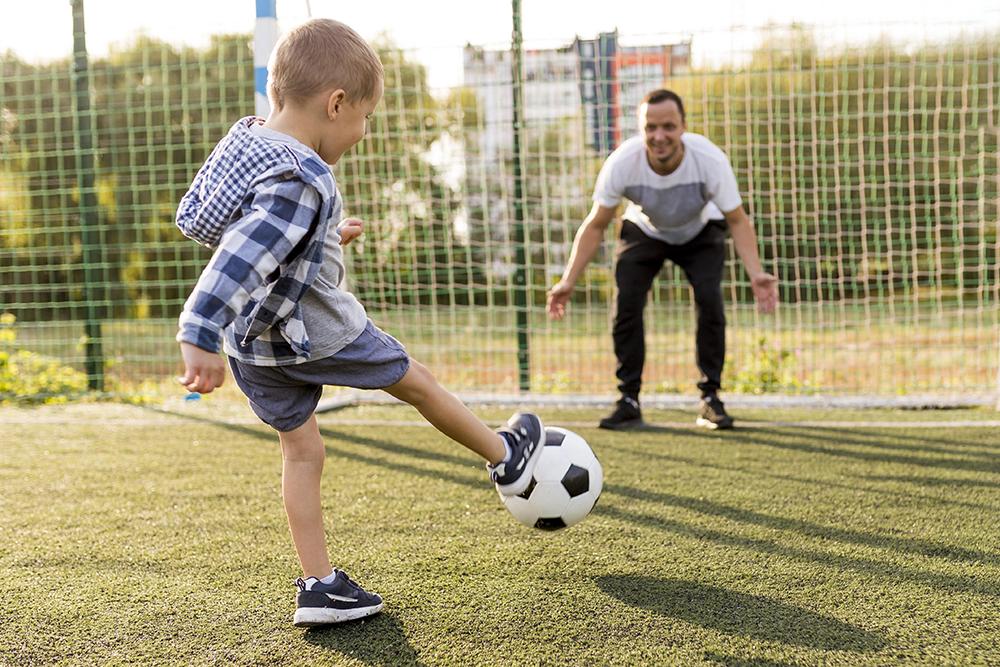 father-son-playing-football
